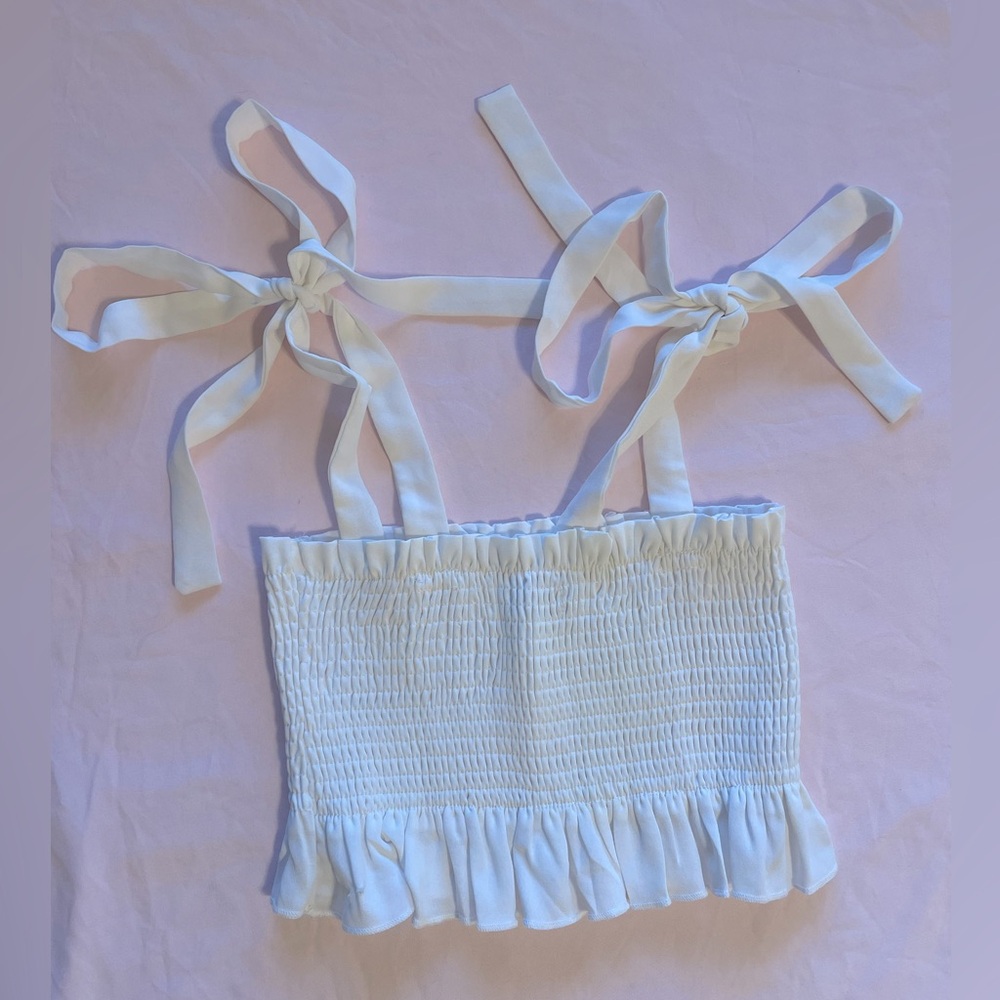 white crop tank top, bows on shoulders.